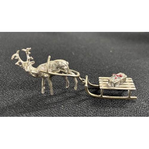 144 - Well cast, tiny white metal Reindeer with Sledge,

approx 10cm long