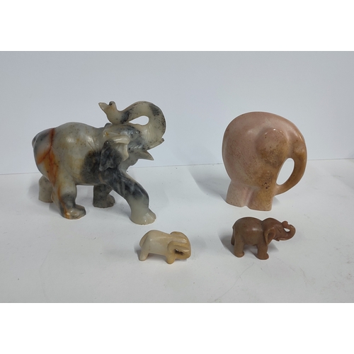 240 - Four elephant figures in various forms (4)