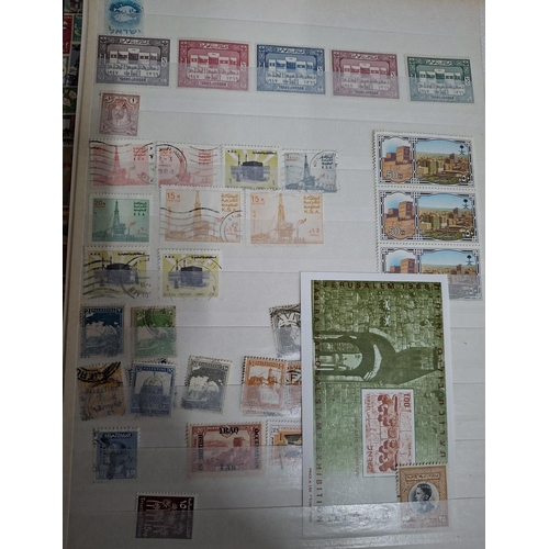 323 - Three albums containing a good collection of world and Commonwealth 20thC stamps, Hong Kong, Holland... 