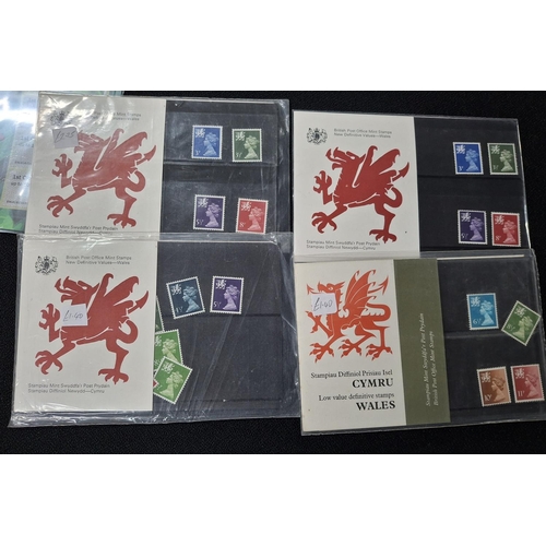 351 - Twenty GB QEII 21stC stamp packs together with 4 earlier Welsh definitive stamp packs (24)