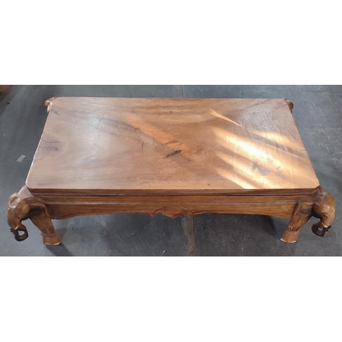 466 - A stunning hand-carved wooden coffee table with Elephant depictions to all four corners