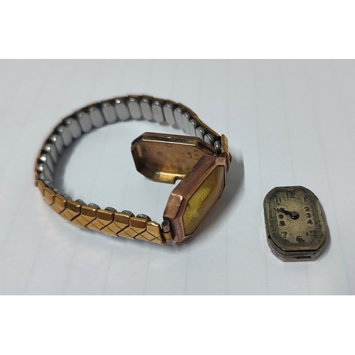 50A - A 15 jewel wristwatch with hallmarked rose gold surround and back, approx. 5 grams with metal excali... 