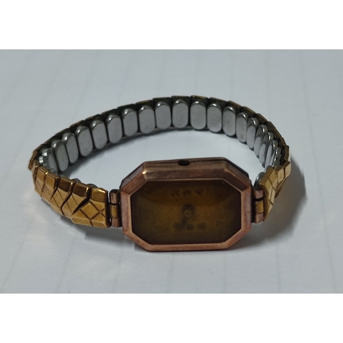 50A - A 15 jewel wristwatch with hallmarked rose gold surround and back, approx. 5 grams with metal excali... 