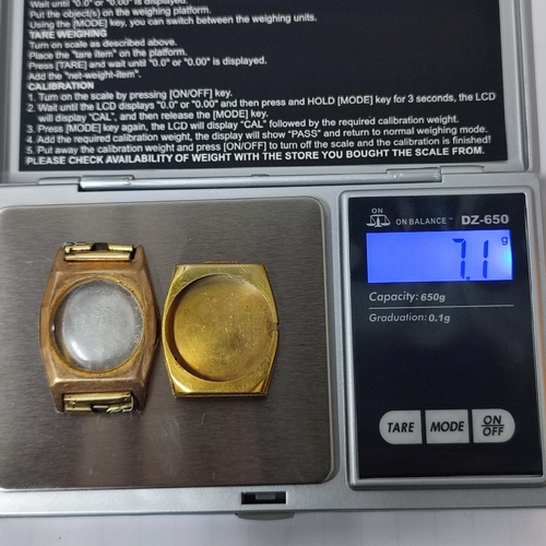 51A - A 15 jewel wristwatch face with hallmarked Gold back and front, approx. 3 grams / 7.1 grams gross