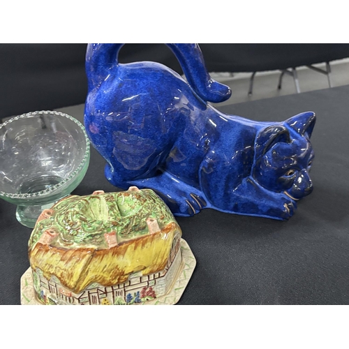 300 - Quantity of ceramics to include a WWI peace beaker and a large, modern, blue glazed cat (Qty)