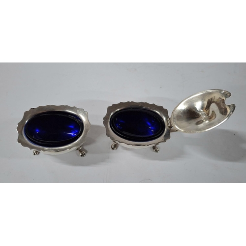 9 - Matching hallmarked Birmingham 1983 silver salt and mustard pot, both with blue glass liners (2),

T... 