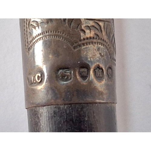 68 - Stunning Victorian 1887 worked and engraved London silver handled cane.