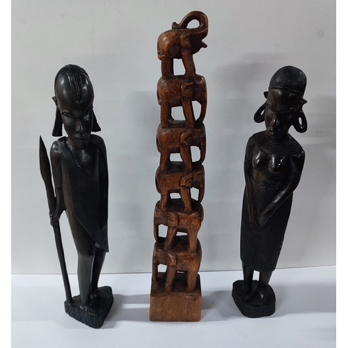 78 - A pair of wooden African figure carvings and a wooden elephant carving (2)