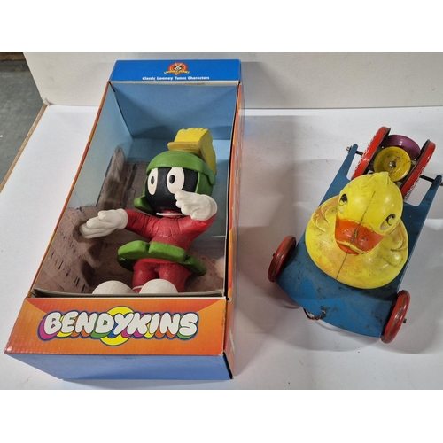 84 - Boxed Bendykins figure together with an earlier tin plate toy with later plastic Duck attached (2)