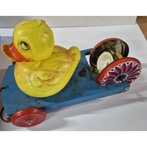 84 - Boxed Bendykins figure together with an earlier tin plate toy with later plastic Duck attached (2)