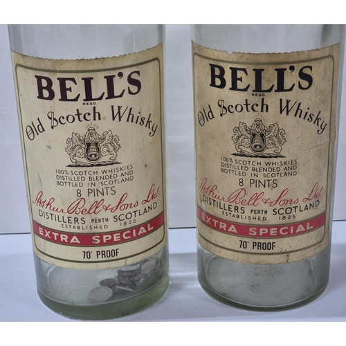 86 - Two 8 pint Bells Whisky bottles, one with a stopper and one with a small amount of GB coins (2)