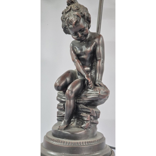 90 - Fine quality metal table lamp with a seated boy