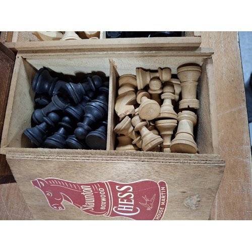 109 - STAUNTON wooden chess set in original box together with 3 other similar wooden chess sets, all possi... 