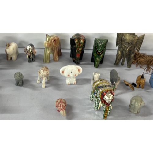 144 - A large collection of elephant ornaments