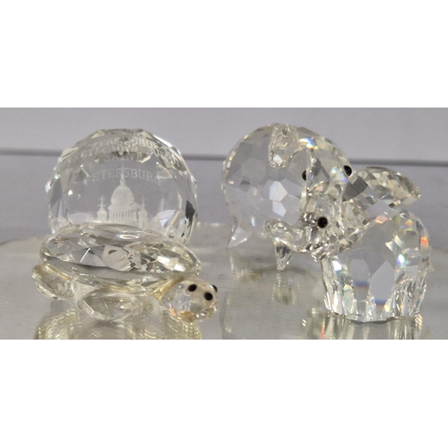 166 - Group of four small Swarovski figurines on mirrored base