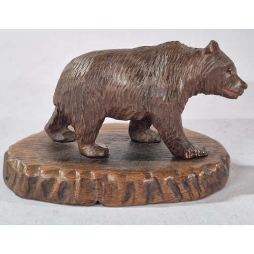 169 - Early/mid 20thC Black Forest Bear on wood plinth