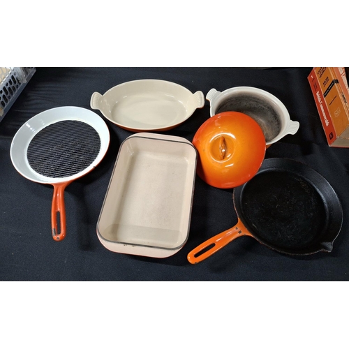 210 - Five pieces of orange Le Creuset including a lidded casserole dish and 2 frying pans etc (5)