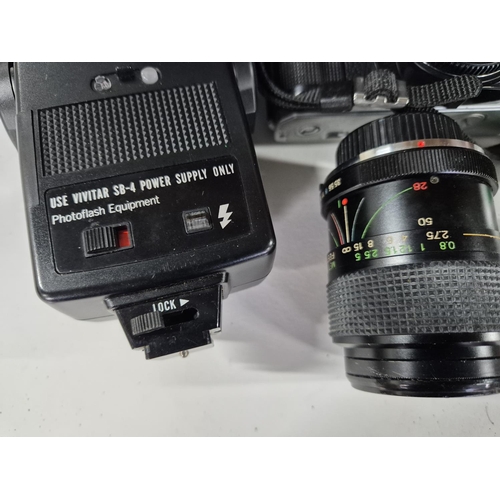 220 - Minolta X-300 with lense and flash together with a carry case