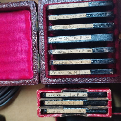 242 - Box full of antique and vintage optical equipment including lenses and boxed antique filters (Qty)