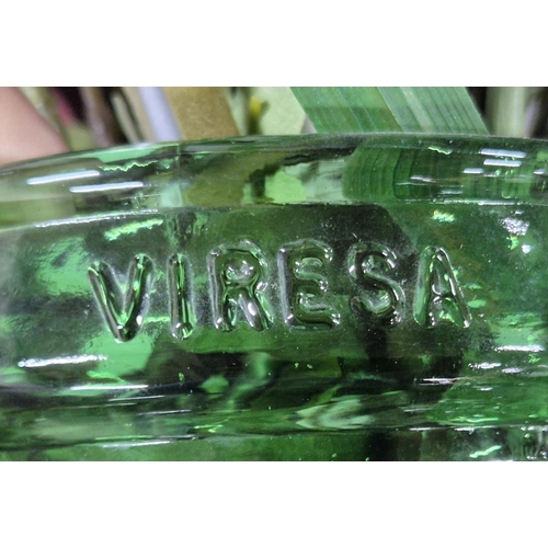 281 - Large green glass carboy by Viresa complete with a bouquet of plastic flowers