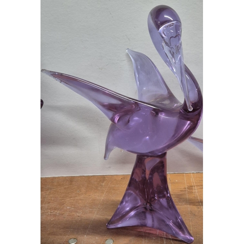 309 - Three huge (approx 46cm tall) purple glass, Elephant, bird and fish figurines, indistinctly signed t... 