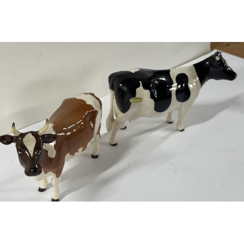 329 - Two Beswick Cows A/F