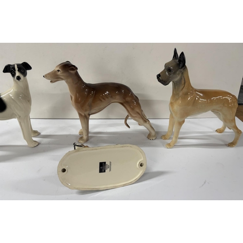 344 - 4 Ceramic dogs including Royal Doulton