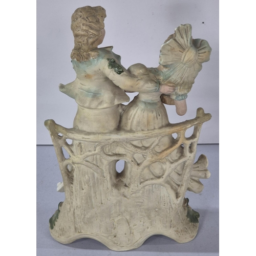 359 - Large mid 19thC unmarked, central European bisque porcelain figurine depicting a couple on a bench