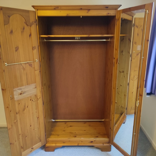 474 - Ducal Pine double wardrobe, will need re-assembling, with keys and hanging rails