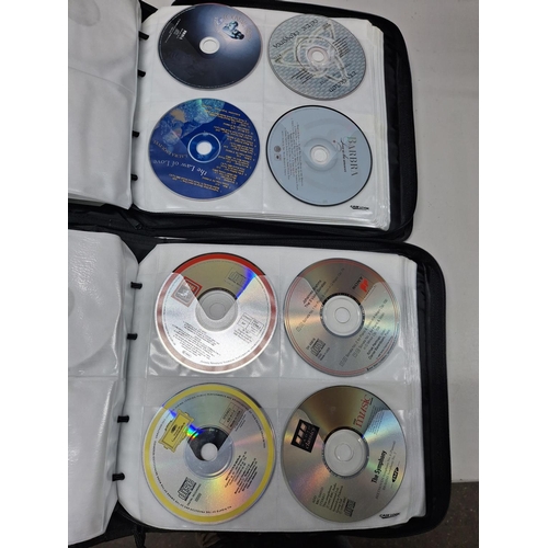 44 - Two Case Logic CD casers, both crammed full with music and audio story CDs (Qty)