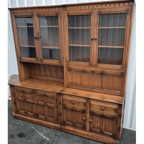 483 - Large Ercol sideboard with glazed cabinets in 2 parts together with a small triangualar corner end