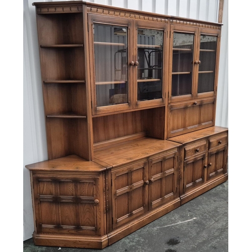 483 - Large Ercol sideboard with glazed cabinets in 2 parts together with a small triangualar corner end