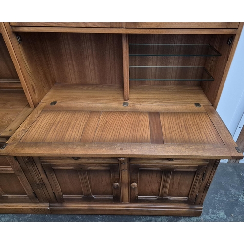 483 - Large Ercol sideboard with glazed cabinets in 2 parts together with a small triangualar corner end