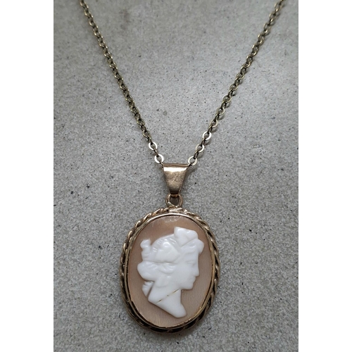 12 - Antique 9ct gold pendent containing a cameo with an unmarked gold coloured metal chain