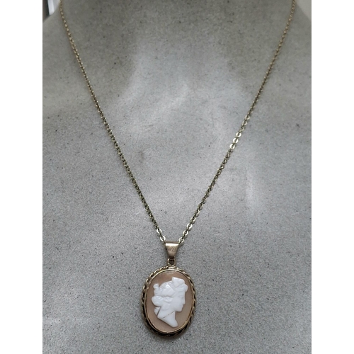 12 - Antique 9ct gold pendent containing a cameo with an unmarked gold coloured metal chain