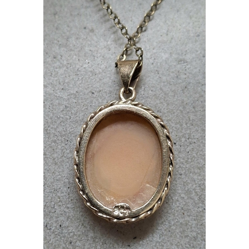 12 - Antique 9ct gold pendent containing a cameo with an unmarked gold coloured metal chain