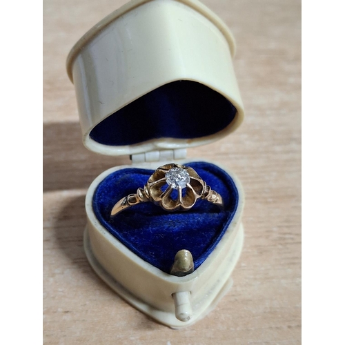 20 - Solitaire diamond set in an unmarked, white metal ring which is sold in a pleasing old, heart shaped... 