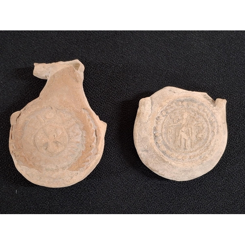 52 - Two Coptic terracotta Saint Menas souvenir pilgrim's flasks, both decorated with both sides, both a/... 