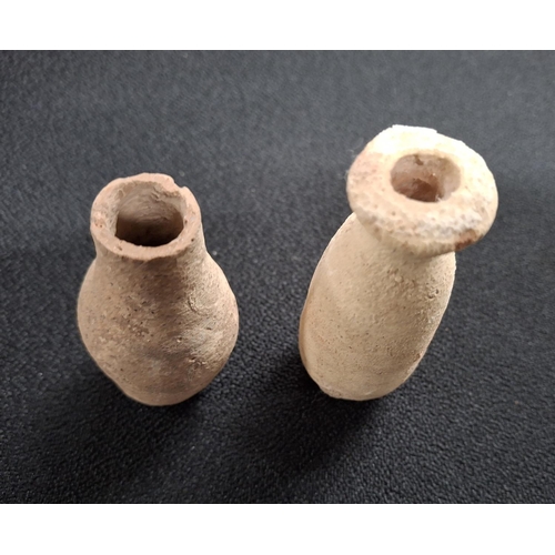 54 - Two small Roman terracotta jars, one with a flared rim (2),

The largest measures 8cm tall