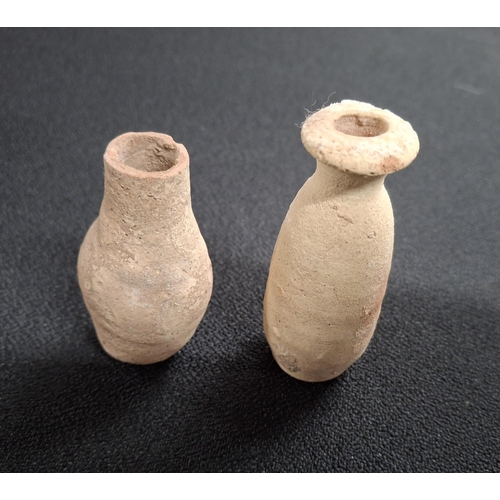 54 - Two small Roman terracotta jars, one with a flared rim (2),

The largest measures 8cm tall