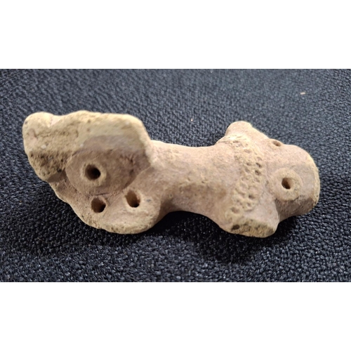 55 - Roman stone worked weight or harnessing mechanism with 2 drilled holes to the top left side and 2 ot... 