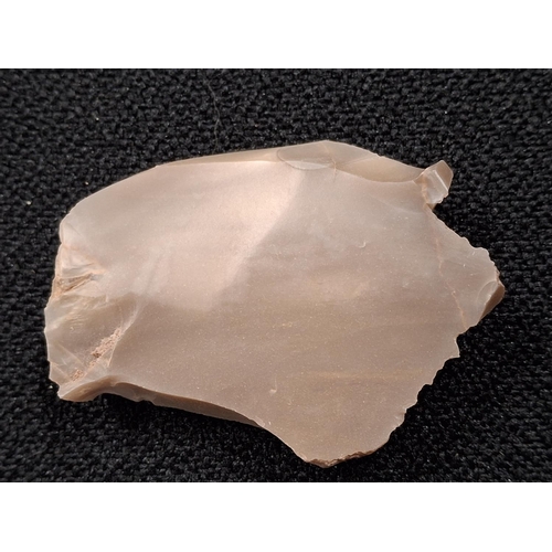 58 - Neolithic sharpened stone tool,

5.5 x 4.5cm