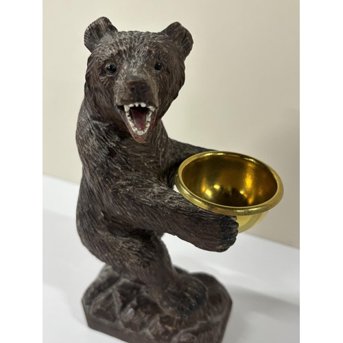 73 - Early 20thC Black Forrest carving with standing Bear holding a gilt metal bowl,

The size is approx ... 