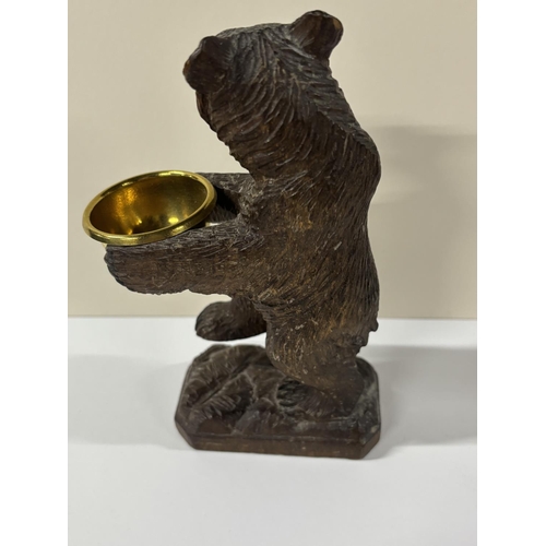 73 - Early 20thC Black Forrest carving with standing Bear holding a gilt metal bowl,

The size is approx ... 