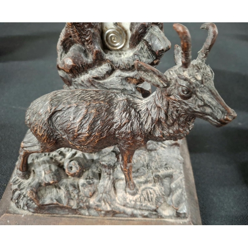 78 - Antique Black Forest carving of a Deer before an old tree stump which incorporates a barometer,

28c... 