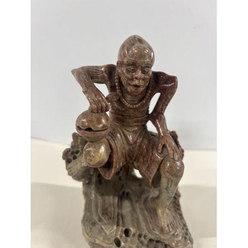 90 - Fine quality 19thC Chinese soapstone carving of a squatting man,

The carving measures approx 17cm t... 