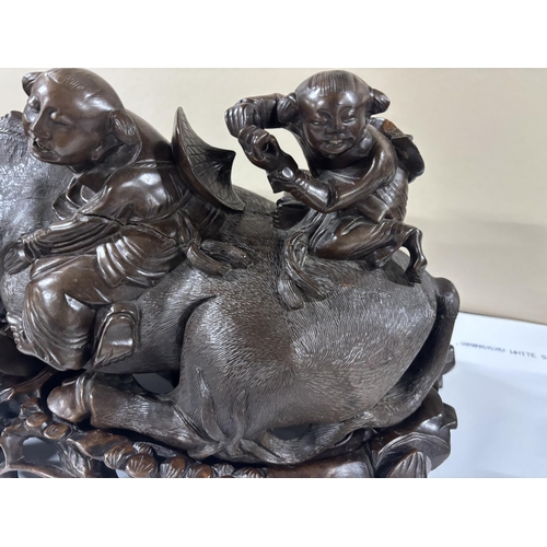 92 - Stunning, large, detailed 19thC hardwood carving of 2 Chinese men riding on the back of a water Buff... 