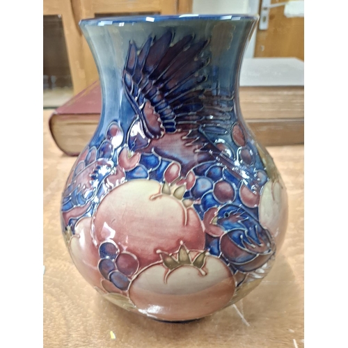 284 - Fine, large bulbus Moorcroft vase with fruit and bird decoration,

24cm tall