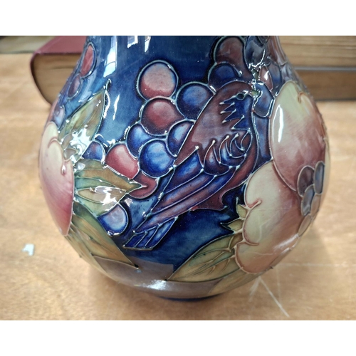 284 - Fine, large bulbus Moorcroft vase with fruit and bird decoration,

24cm tall