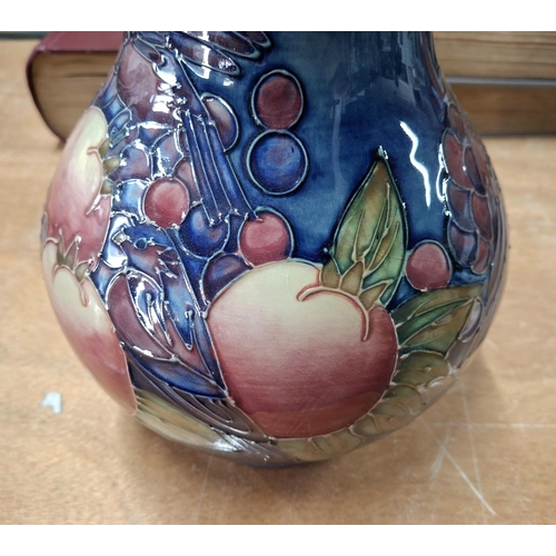 284 - Fine, large bulbus Moorcroft vase with fruit and bird decoration,

24cm tall